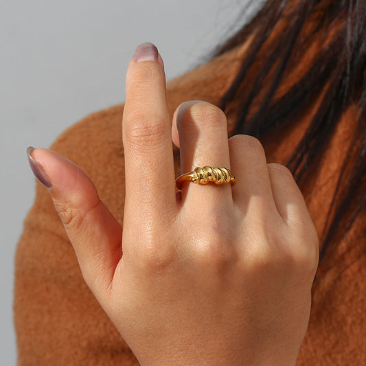 Close-up view of our Elegant Threaded Croissant Ring - Stainless Steel Twist Plated, showcasing its modern design and timeless beauty.