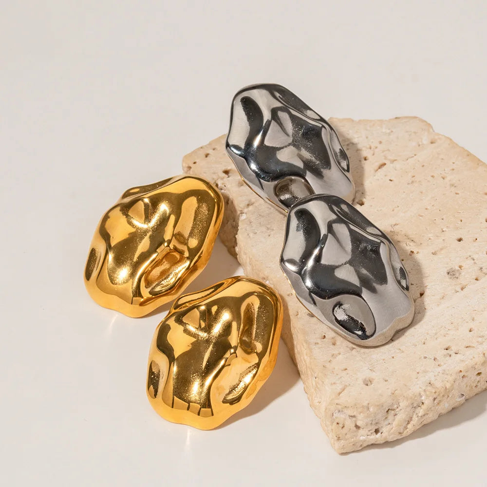 Chic stainless steel earrings featuring an exquisite Twist Lava Textured design, marrying modern flair with timeless sophistication for a bold and unique accessory.