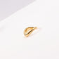 Curved gold band ring on woman's finger — PURAJOIA
