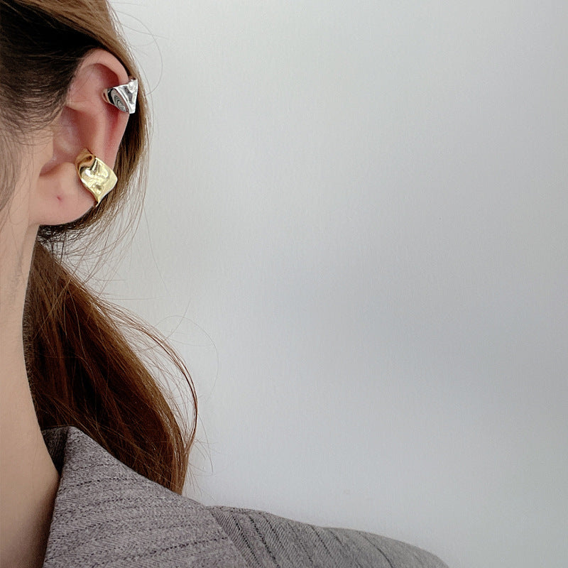 Sterling silver ear clip featuring a chic geometric bump design, adding modern sophistication to your jewelry collection