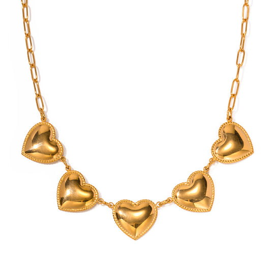 Shiny gold necklace with five heart pendants, crafted from durable stainless steel for a stylish and elegant look.