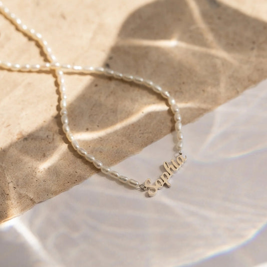 Elegant and waterproof, our Pearl Name Necklace combines sophistication with durability—a stylish and personalized accessory that defies the elements in timeless fashion.