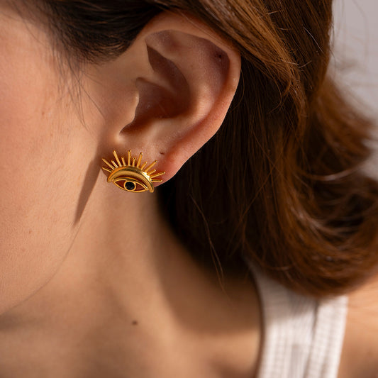 Close-up view of Devil's Eye Design Stud Earrings in 18K Gold-Plated Stainless Steel with Zirconia detailing, showcasing delicate vintage charm and intricate craftsmanship