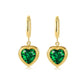 Stainless steel ear clips featuring emerald zircon peach hearts with 18K real gold plating for a touch of timeless elegance.