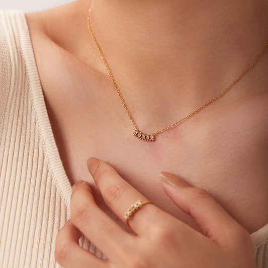 Timeless dainty pendant crafted with white zircon stones