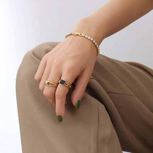 Timeless bracelet with 18K gold inlay and zircon stones