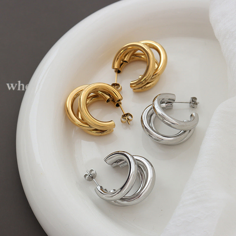 Minimalist three-layer C-shaped earrings, a sleek and versatile accessory for understated elegance.