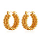 Simple gold stud earrings on model — PURAJOIA