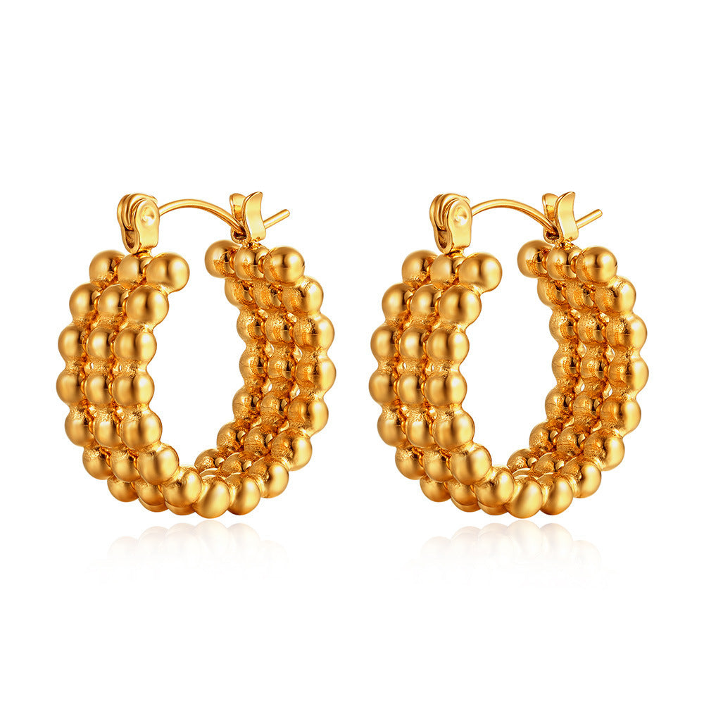 Simple gold stud earrings on model — PURAJOIA