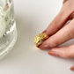 Gold-plated stainless steel lava ring, a radiant and unique accessory that effortlessly blends durability with modern opulence.