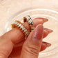 Irregular square gemstone ring crafted with clear baguette design