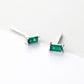 Sterling silver stud earrings featuring square green gems, adding a touch of elegance and vibrancy to your accessory collection.