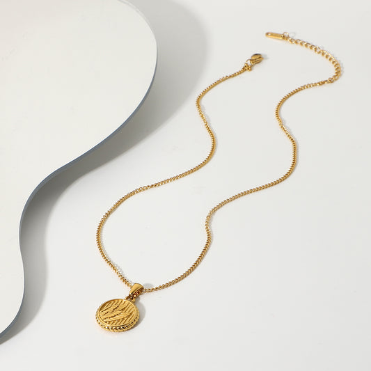 Simple necklace with three dimensional wings round coin pendant