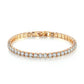 Gold diamond tennis chain bracelet on woman's wrist — PURAJOIA