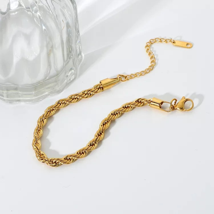 Twist Bracelet in Gold, a trendy and versatile addition to your collection - perfect for stacking and layering.