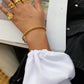 Twist Bracelet in Gold, a trendy and versatile addition to your collection - perfect for stacking and layering.