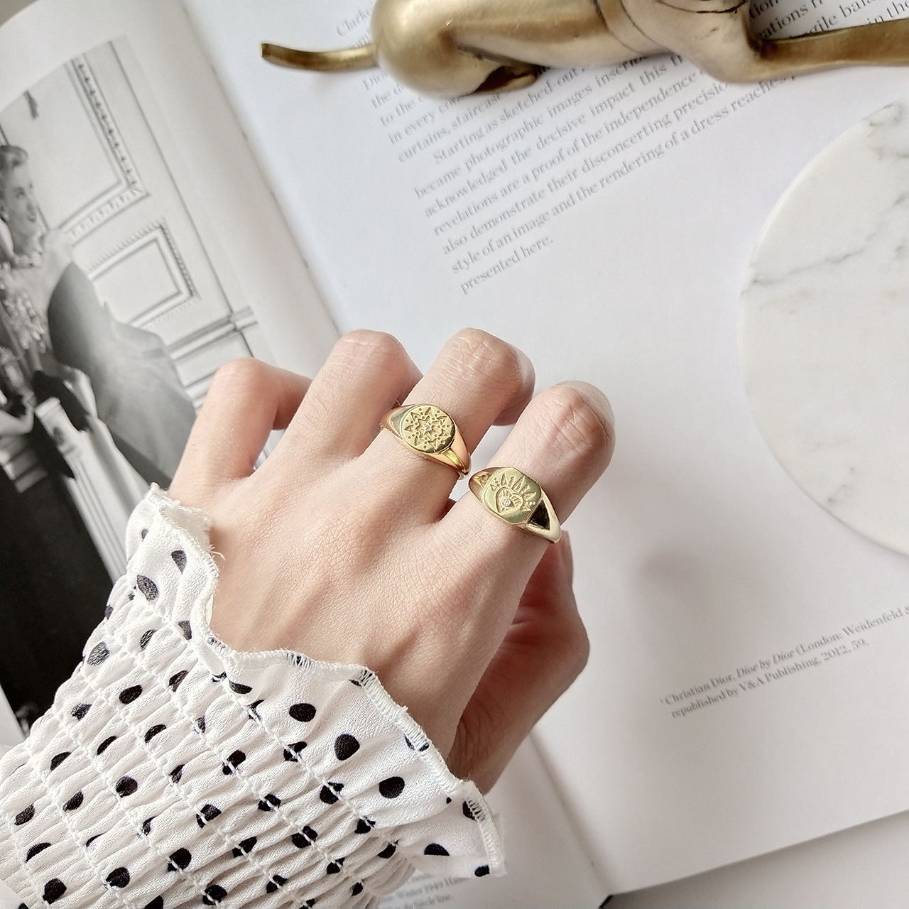 Vintage style sterling silver ring with detailed retro patterns